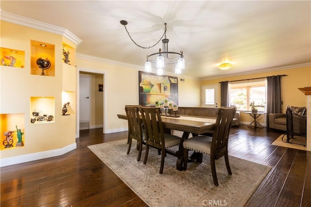 724 Forestview Ave, La Puente, CA 91746 - dining area with a chandelier, dark wood finished floors, baseboards, and crown molding