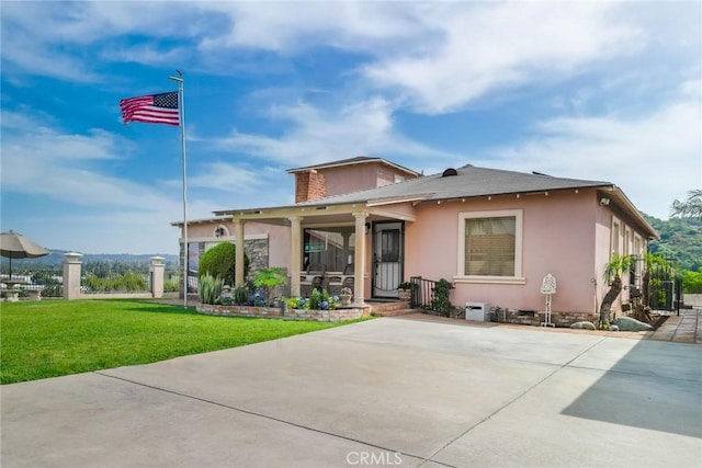724 Forestview Ave, La Puente, CA 91746 - view of front facade with a front lawn, stucco siding, and covered porch