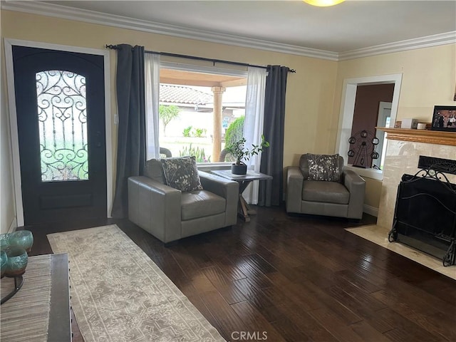 724 Forestview Ave, La Puente, CA 91746 - living room featuring dark wood-type flooring, ornamental molding, and a tiled fireplace