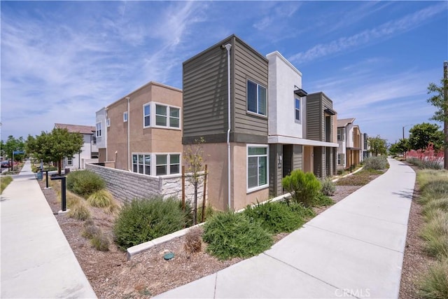 26956 Nature View Pl, Valencia, CA 91355 - view of home's exterior featuring stucco siding and a residential view
