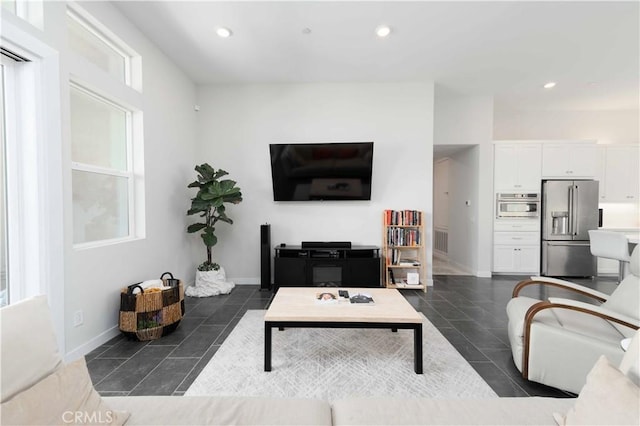 26956 Nature View Pl, Valencia, CA 91355 - living room with recessed lighting, baseboards, and dark tile patterned flooring