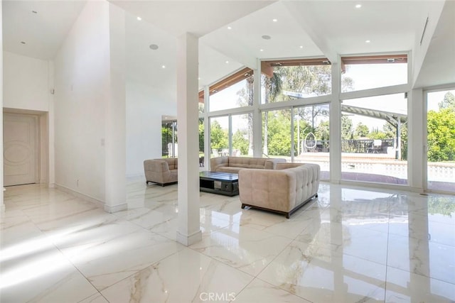12410 Mclennan Ave, Granada Hills, CA 91344 - living area with a high ceiling and light marble finish floors