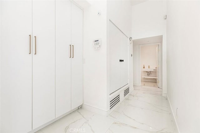 12410 Mclennan Ave, Granada Hills, CA 91344 - hallway featuring light marble finish floors
