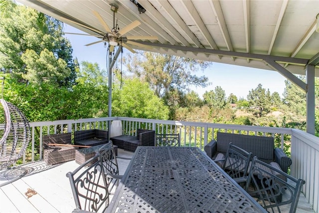 12410 Mclennan Ave, Granada Hills, CA 91344 - wooden deck featuring outdoor lounge area, a ceiling fan, view of scattered trees, and outdoor dining area