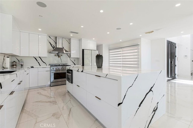 12410 Mclennan Ave, Granada Hills, CA 91344 - kitchen with modern cabinets, wall chimney range hood, high end range, white cabinets, and recessed lighting