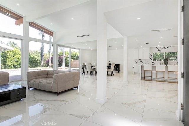 12410 Mclennan Ave, Granada Hills, CA 91344 - living area with light marble finish floors and a towering ceiling