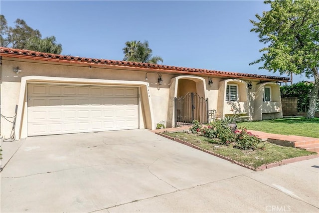 12410 Mclennan Ave, Granada Hills, CA 91344 - mediterranean / spanish-style home with stucco siding, a garage, driveway, and a front yard