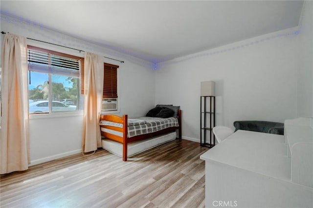 502 S Rosario Ave, San Jacinto, CA 92583 - bedroom with light wood-type flooring, baseboards, and cooling unit