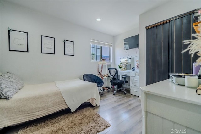 502 S Rosario Ave, San Jacinto, CA 92583 - bedroom featuring an office area, wood finished floors, and recessed lighting