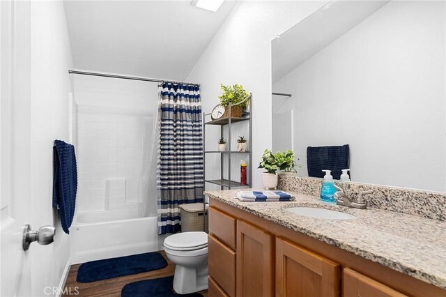 1863 Norwood Dr, Paradise, CA 95969 - bathroom featuring vanity, toilet, vaulted ceiling, shower / tub combo, and wood finished floors