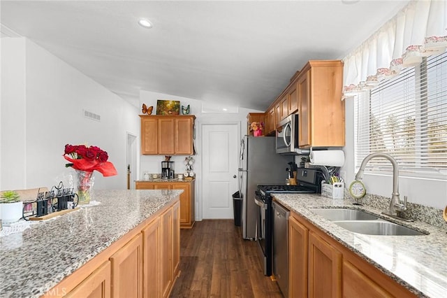 1863 Norwood Dr, Paradise, CA 95969 - kitchen featuring a sink, lofted ceiling, stainless steel appliances, dark wood-style flooring, and light stone counters