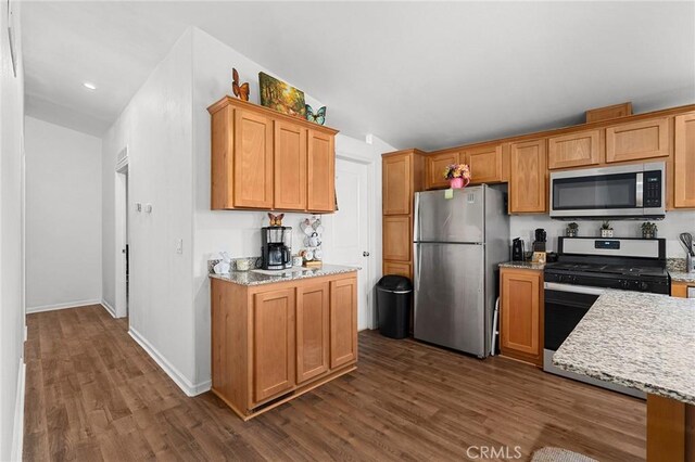 1863 Norwood Dr, Paradise, CA 95969 - kitchen with stainless steel appliances, dark wood-style flooring, light stone counters, baseboards, and recessed lighting