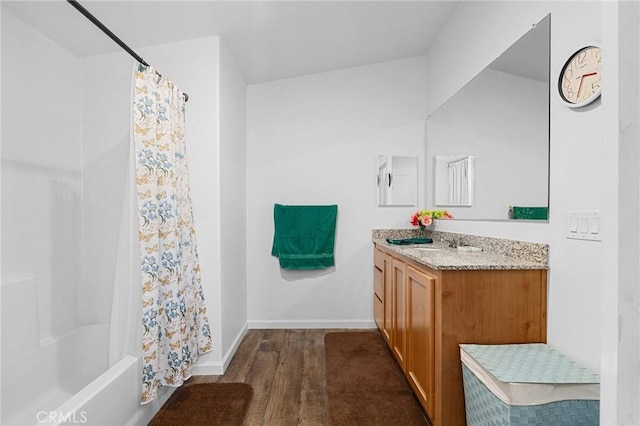 1863 Norwood Dr, Paradise, CA 95969 - bathroom with vanity, wood finished floors, shower / tub combo, and baseboards