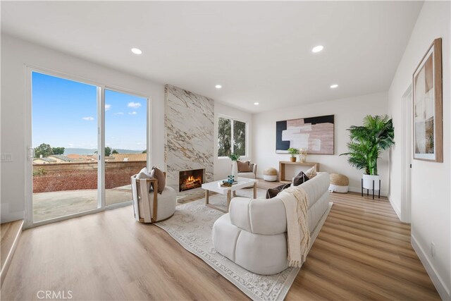 17585 Candela Dr, Rowland Heights, CA 91748 - living room with wood finished floors, a fireplace, recessed lighting, and baseboards