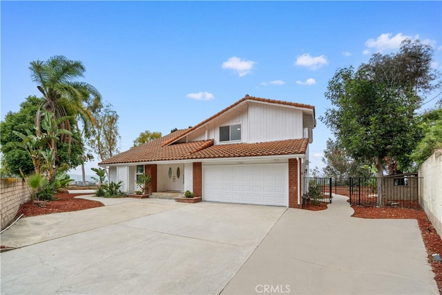 17585 Candela Dr, Rowland Heights, CA 91748 - mediterranean / spanish-style house with a tiled roof, concrete driveway, and an attached garage