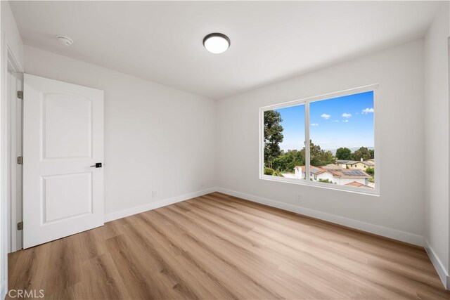 17585 Candela Dr, Rowland Heights, CA 91748 - empty room featuring light wood finished floors, baseboards, and a smoke detector