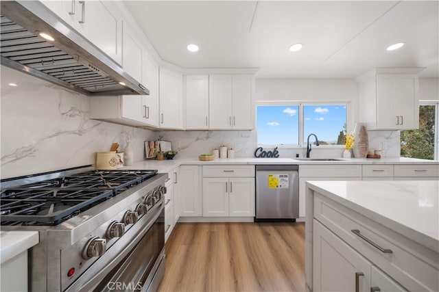 17585 Candela Dr, Rowland Heights, CA 91748 - kitchen featuring appliances with stainless steel finishes, under cabinet range hood, a sink, plenty of natural light, and recessed lighting