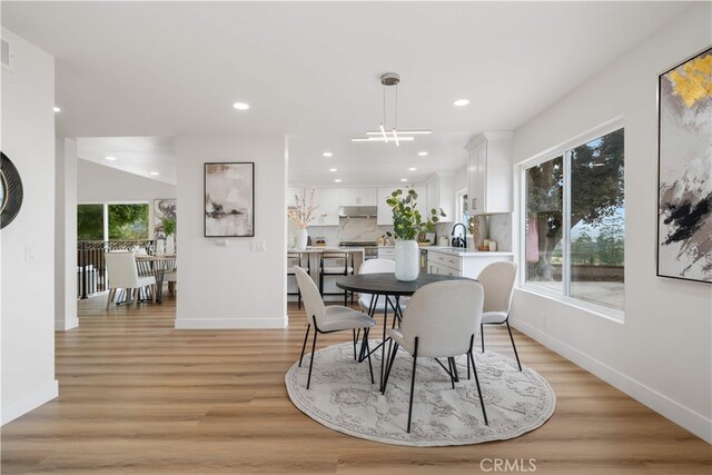 17585 Candela Dr, Rowland Heights, CA 91748 - dining space featuring light wood finished floors, recessed lighting, and baseboards