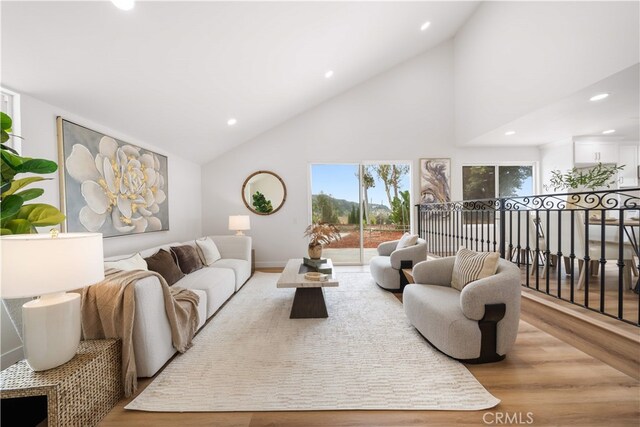 17585 Candela Dr, Rowland Heights, CA 91748 - living area featuring wood finished floors, high vaulted ceiling, recessed lighting, and baseboards