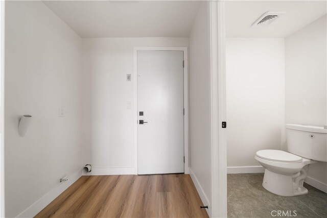 17585 Candela Dr, Rowland Heights, CA 91748 - bathroom with toilet, wood finished floors, and baseboards