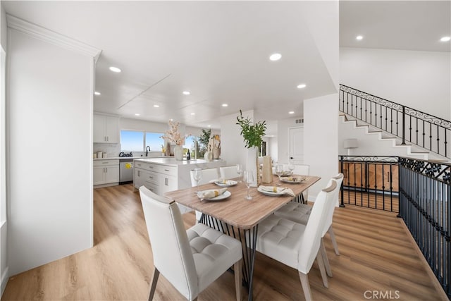 17585 Candela Dr, Rowland Heights, CA 91748 - dining room with light wood-type flooring, recessed lighting, and stairway