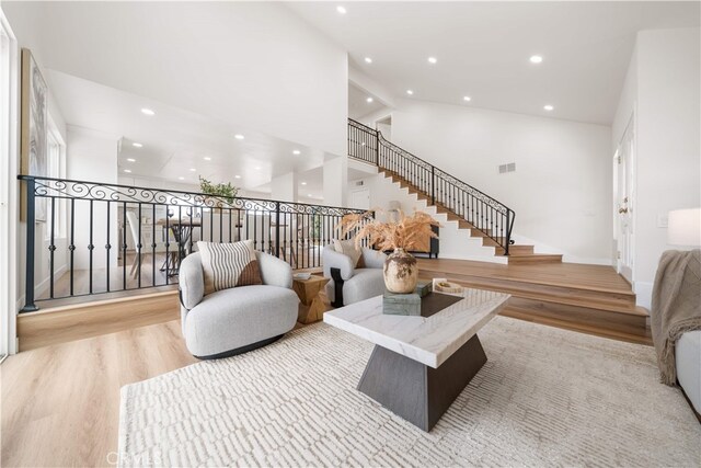 17585 Candela Dr, Rowland Heights, CA 91748 - living area with wood finished floors, recessed lighting, stairway, and high vaulted ceiling