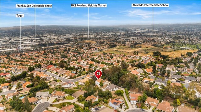 17585 Candela Dr, Rowland Heights, CA 91748 - aerial overview of property's location with nearby suburban area