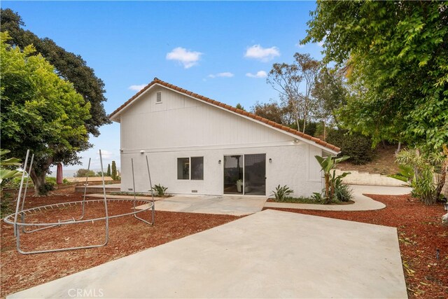 17585 Candela Dr, Rowland Heights, CA 91748 - rear view of house featuring a tile roof, a patio area, and stucco siding