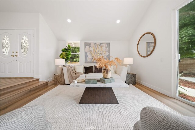 17585 Candela Dr, Rowland Heights, CA 91748 - living area featuring vaulted ceiling, wood finished floors, baseboards, healthy amount of natural light, and recessed lighting