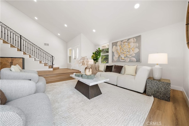 17585 Candela Dr, Rowland Heights, CA 91748 - living room featuring recessed lighting, wood finished floors, stairs, baseboards, and vaulted ceiling