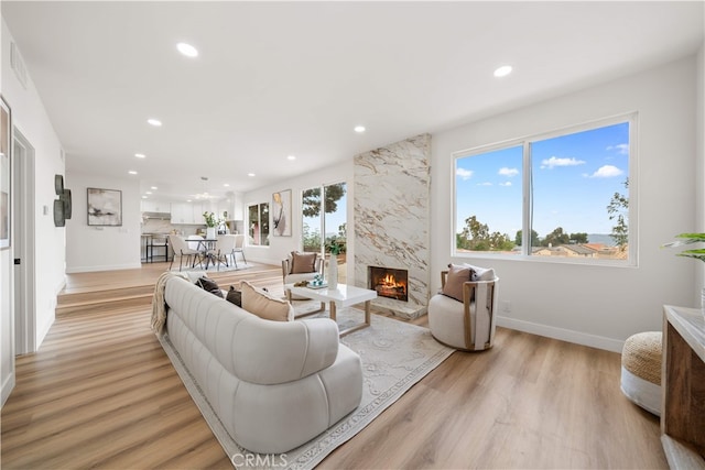 17585 Candela Dr, Rowland Heights, CA 91748 - living area with recessed lighting, a fireplace, light wood-style flooring, and baseboards