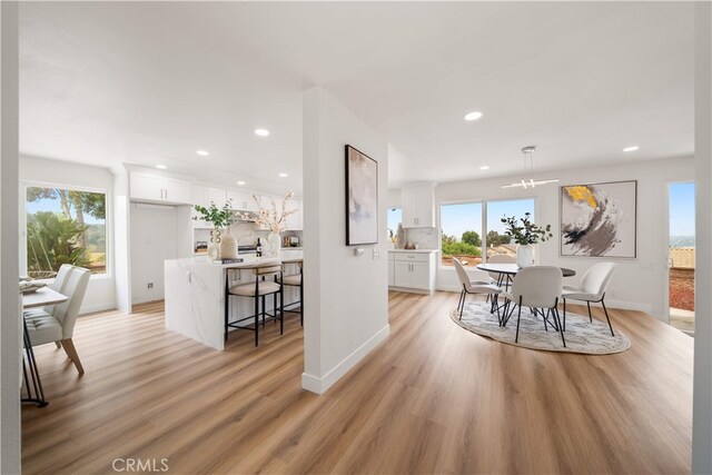 17585 Candela Dr, Rowland Heights, CA 91748 - dining area with recessed lighting, healthy amount of natural light, light wood-style floors, and baseboards