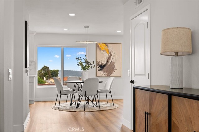 17585 Candela Dr, Rowland Heights, CA 91748 - dining space featuring light wood-type flooring, baseboards, recessed lighting, and a chandelier