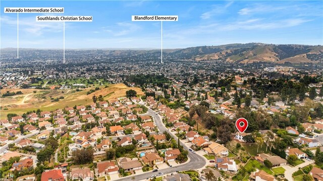 17585 Candela Dr, Rowland Heights, CA 91748 - aerial view of property's location featuring a mountainous background and nearby suburban area