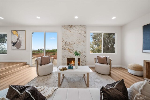 17585 Candela Dr, Rowland Heights, CA 91748 - living room with healthy amount of natural light, wood finished floors, a fireplace, recessed lighting, and baseboards