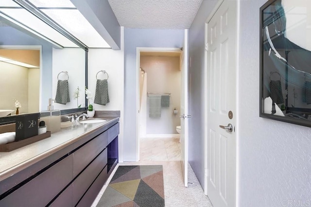 5605 Friars Rd Unit 323, San Diego, CA 92110 - full bathroom with vanity, a shower with curtain, toilet, and a textured ceiling