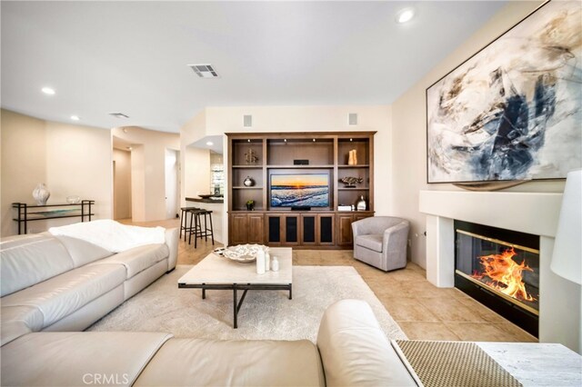 79980 Merion Ln, Quinta, CA 92253 - living area featuring a glass covered fireplace and recessed lighting