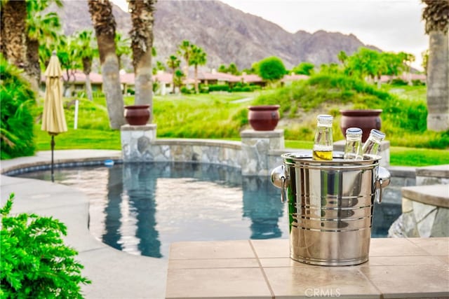 79980 Merion Ln, Quinta, CA 92253 - swimming pool featuring a mountain view and a patio area