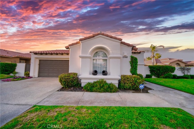 79980 Merion Ln, Quinta, CA 92253 - mediterranean / spanish-style house featuring a tile roof, driveway, a garage, and stucco siding