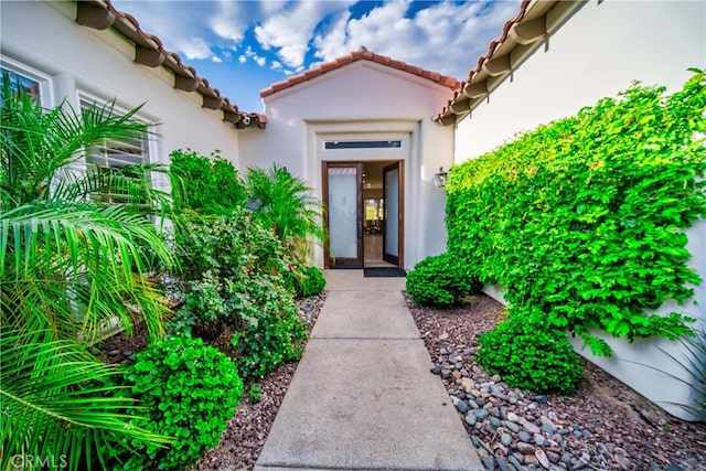 79980 Merion Ln, Quinta, CA 92253 - doorway to property with stucco siding and a tile roof