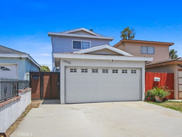 14906 Grevillea Ave, Lawndale, CA 90260 - traditional-style home with stucco siding, driveway, and a garage