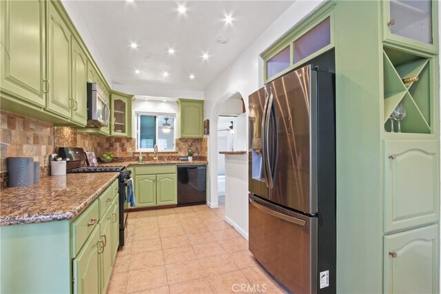 14906 Grevillea Ave, Lawndale, CA 90260 - kitchen featuring stainless steel appliances, green cabinetry, a sink, tasteful backsplash, and light tile patterned floors