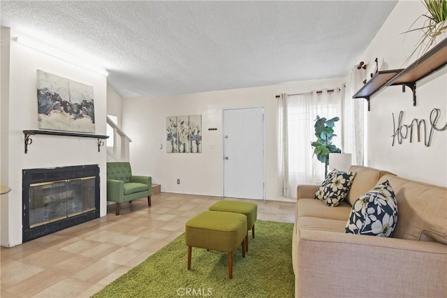 14906 Grevillea Ave, Lawndale, CA 90260 - living area featuring a glass covered fireplace and a textured ceiling