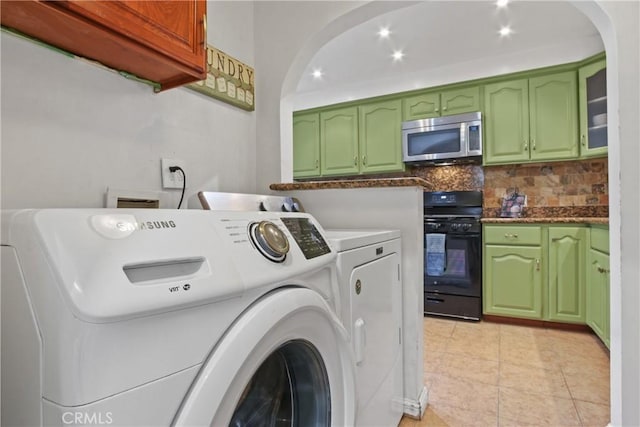 14906 Grevillea Ave, Lawndale, CA 90260 - laundry room with separate washer and dryer, arched walkways, and light tile patterned flooring