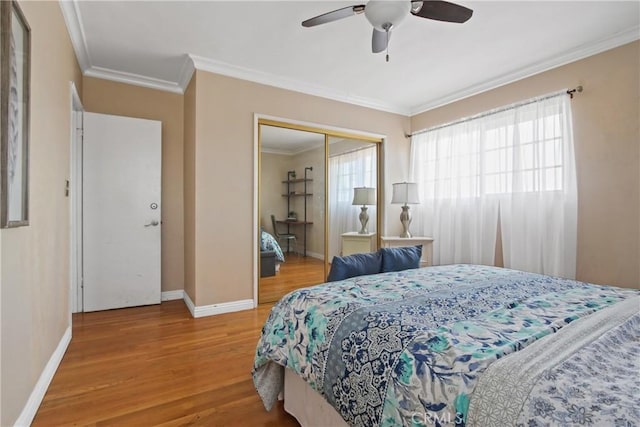 14906 Grevillea Ave, Lawndale, CA 90260 - bedroom with wood finished floors, a closet, crown molding, baseboards, and ceiling fan