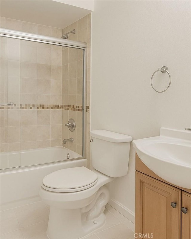 20930 Parthenia St Unit 109, Canoga Park, CA 91304 - full bath featuring tile patterned floors, vanity, toilet, and combined bath / shower with glass door