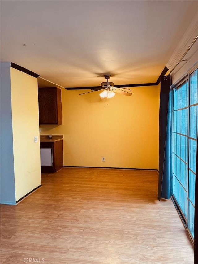 20930 Parthenia St Unit 109, Canoga Park, CA 91304 - unfurnished living room featuring light wood-type flooring, ceiling fan, crown molding, and baseboards