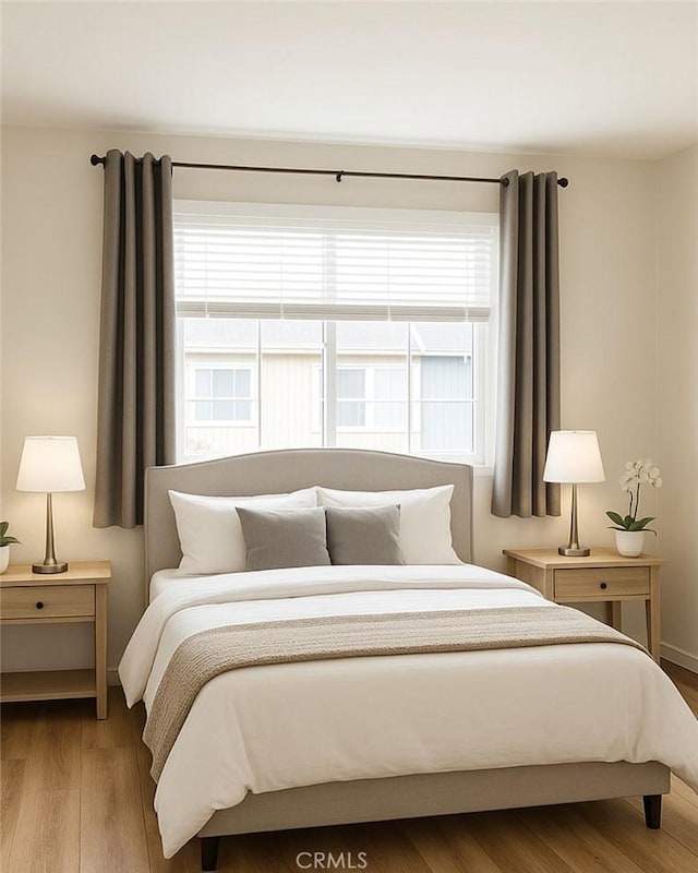 20930 Parthenia St Unit 109, Canoga Park, CA 91304 - bedroom featuring wood finished floors and baseboards