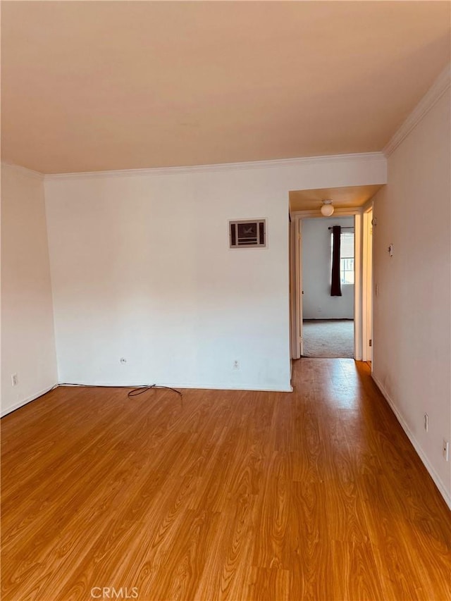 20930 Parthenia St Unit 109, Canoga Park, CA 91304 - empty room featuring crown molding, light wood-style flooring, and baseboards