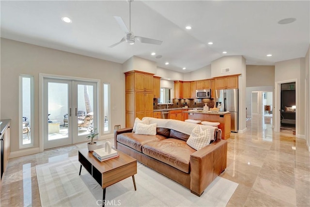1806 Lake St, Huntington Beach, CA 92648 - living area with french doors, ceiling fan, lofted ceiling, recessed lighting, and light marble finish floors